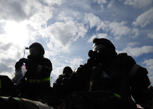 Airmen from the 437th Operations Group respond to an evacuation order during the Operational Readiness Inspection at Gulfport, Miss. Dec. 3, 2011. The evacuation order was given in response to a simulated fire in their primary building. More than 600 Airmen simulated a deployment for the Operational Readiness Inspection that tested basic Airman knowledge, such as Self Aid Buddy Care and Chemical Biological Radioactive Nuclear and Explosive responses among many others. (U.S. Air Force photo/Staff Sgt. Katie Gieratz) (Released)