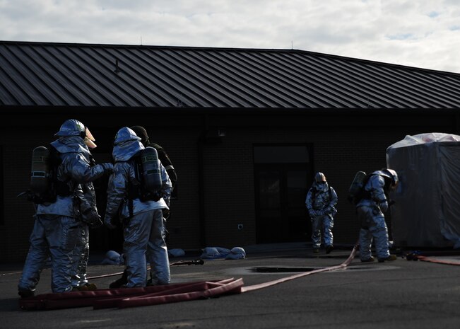 Firefighters from the 628th Civil Engineer Squadron Fire Department respond to a simulated fire during the Operational Readiness Inspection at Gulfport Miss. Dec. 3, 2011. More than 600 Airmen from Joint Base Charleston, S.C. simulated a deployment for the ORI. (U.S. Air Force photo/Staff Sgt. Katie Gieratz)(Released)