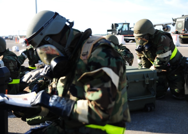 Airmen from the 437th Operations Group respond to an evacuation order during the Operational Readiness Inspection at Gulfport, Miss. Dec. 3, 2011. The evacuation order was given in response to a simulated fire in their primary building testing both firefighting and accountability procedures.. (U.S. Air Force photo/Staff Sgt. Katie Gieratz)(Released)