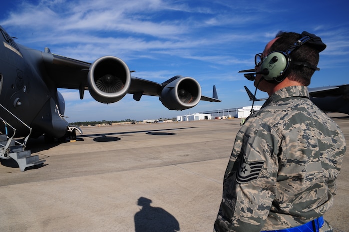 Technical Sgt. Jeffrey Dubert does a pre-flight inspection on a C-17 Globemaster III during the Operational Readiness Inspection at Gulfport, Miss. Dec. 2, 2011. Air Mobility Command's primary mission is rapid, global mobility, and sustainment for America's armed forces. Dubert is a crew chief with the 315th Aircraft Maintenance Squadron. (U.S. Air Force photo/Staff Sgt. Katie Gieratz)(Released)