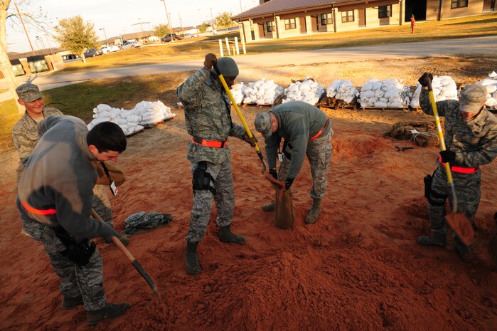 Airmen from the 628th Security Forces Squadron prepare sandbags to build Defensive Fighting Positions at Gulfport, Miss. Dec. 2, 2011. Joint Base Charleston Airmen simulated a deployment for the Operational Readiness Inspection. (U.S. Air Force photo/Staff Sgt. Katie Gieratz) 