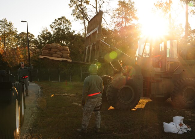 Airmen from the 628th Security Forces Squadron prepare sandbags to build Defensive Fighting Positions during the Operational Readiness Inspection at Gulfport, Miss. Dec. 2, 2011. More than 600 Airmen simulated a deployment that tested basic Airman knowledge, such as Self Aid Buddy Care and Chemical Biological Radioactive Nuclear and Explosive responses among many others. (U.S. Air Force photo/Staff Sgt. Katie Gieratz) (Released)