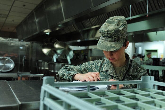 Senior Airman Ronda Verback reviews a food log during the Operational Readiness Inspection at Gulfport, Miss. Dec. 1, 2011. More than 600 Airmen from Joint Base Charleston, S.C. simulated a deployment during the ORI. Verback is a food services journeyman with the 628th Force Support Squadron. (U.S. Air Force photo/Staff Sgt. Katie Gieratz)(Released)