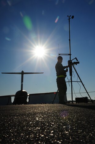 Senior Airman Jared Cochell does a barometer comparison to check the pressure in the earth??s atmosphere at Gulfport, Miss. Dec. 1, 2011. More than 600 Airmen from Joint Base Charleston, S.C. simulated a deployment for the Operational Readiness Inspection. Cochell is a regional weather forecaster with the 437th Operations Support Squadron. (U.S. Air Force photo/Staff Sgt. Katie Gieratz)(Released)