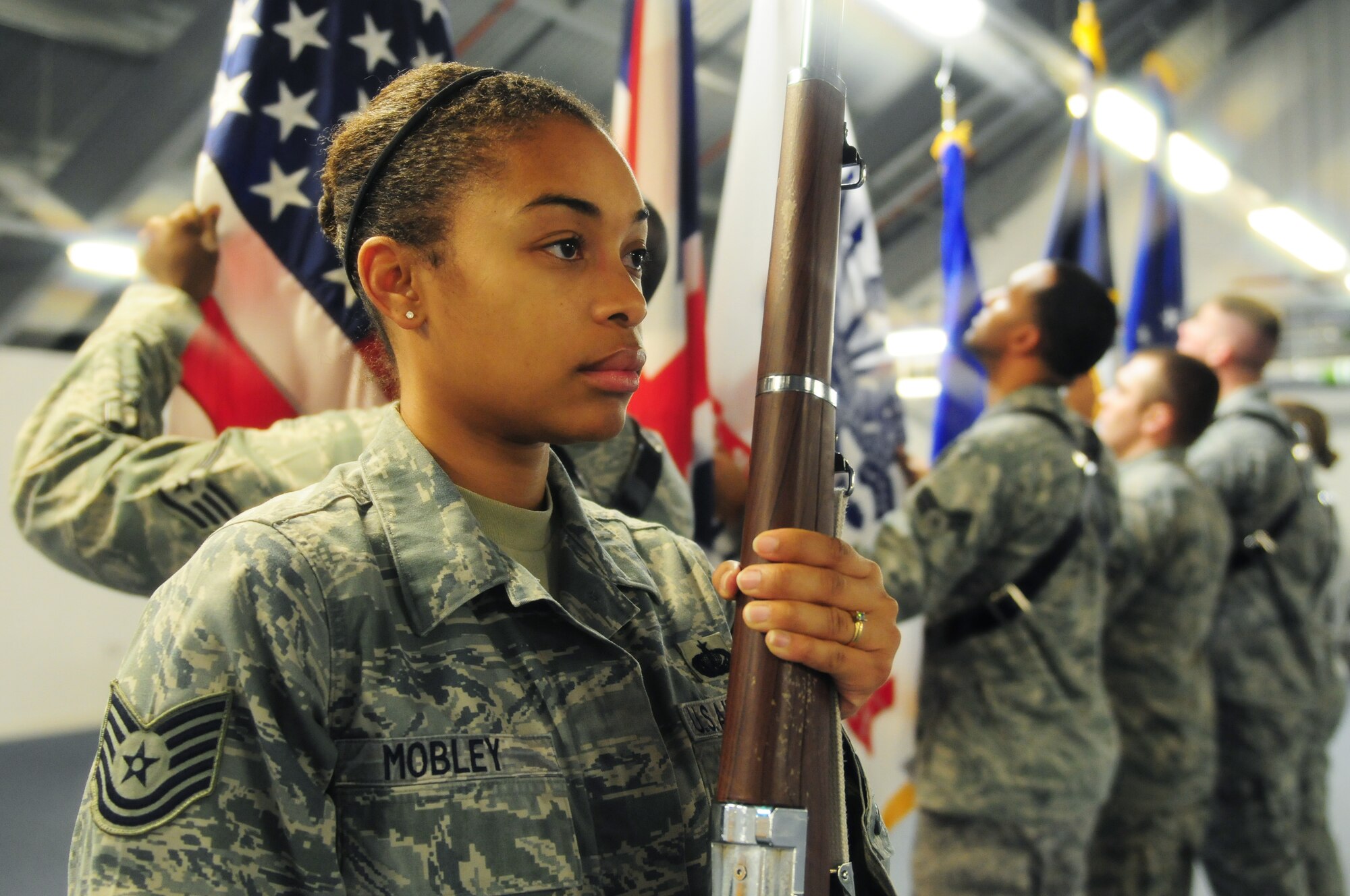 ROYAL AIR FORCE LAKENHEATH, England -- Tech. Sgt. Kiana Mobley,48th Force Support Squadron readiness and mortuary expert , stands at port arms during honor guard practice, Dec. 8, 2011. Mobley was nominated for a Liberty Spotlight because she displays the core value of 'Service Before Self'. (U.S. Air Force photo by Senior Airman Lausanne Morgan)
