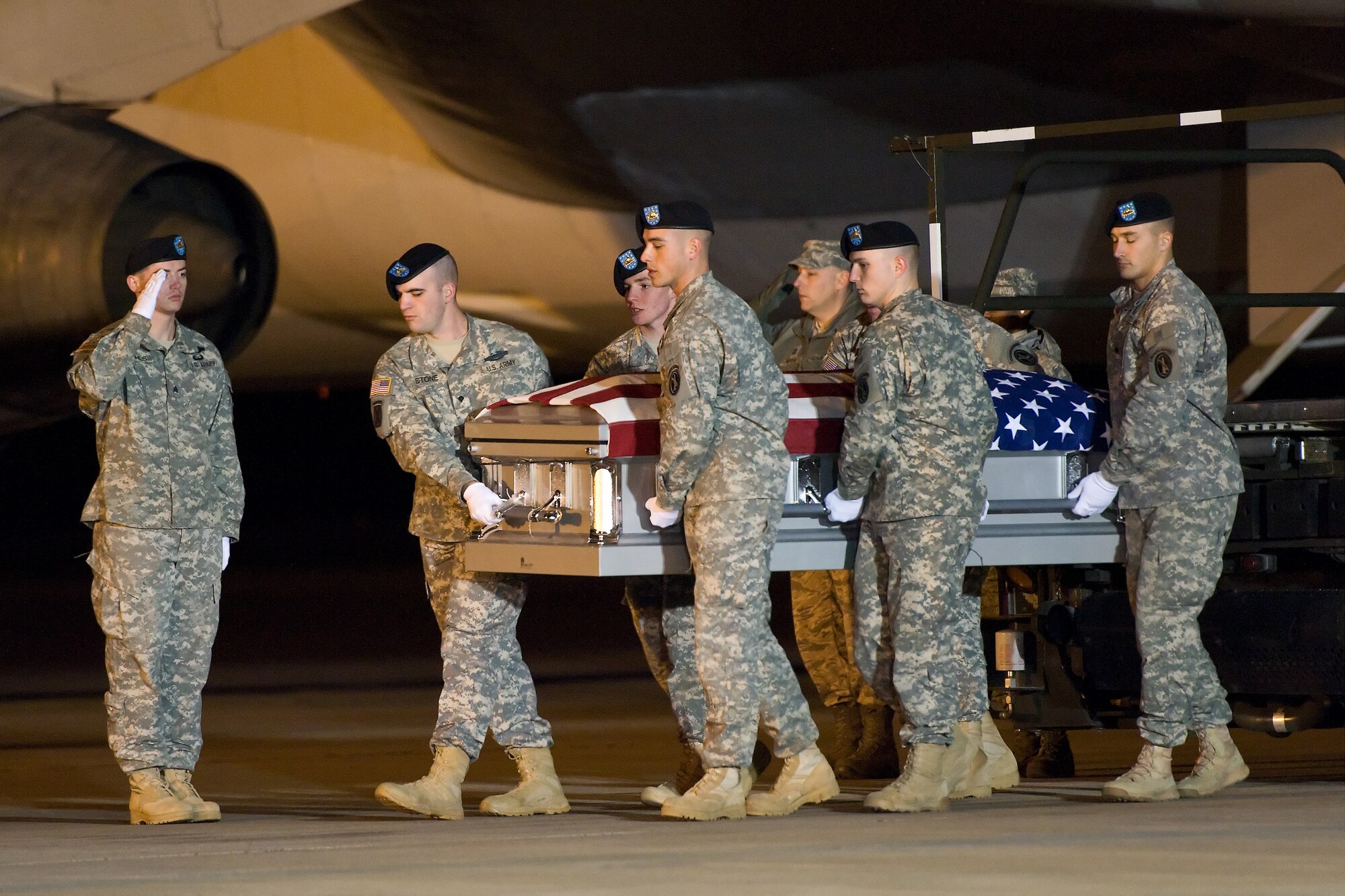 A U.S. Army carry team transfers the remains of Army Sgt. Ryan D. Sharp, of Idaho Falls, Idaho, at Dover Air Force Base, Del., Dec. 8, 2011. Sharp was assigned to the 2nd Battalion, 34th Armor Regiment, 1st Brigade Combat Team, 1st Infantry Division, Ft. Riley, Kan. (U.S. Air Force photo/Roland Balik)