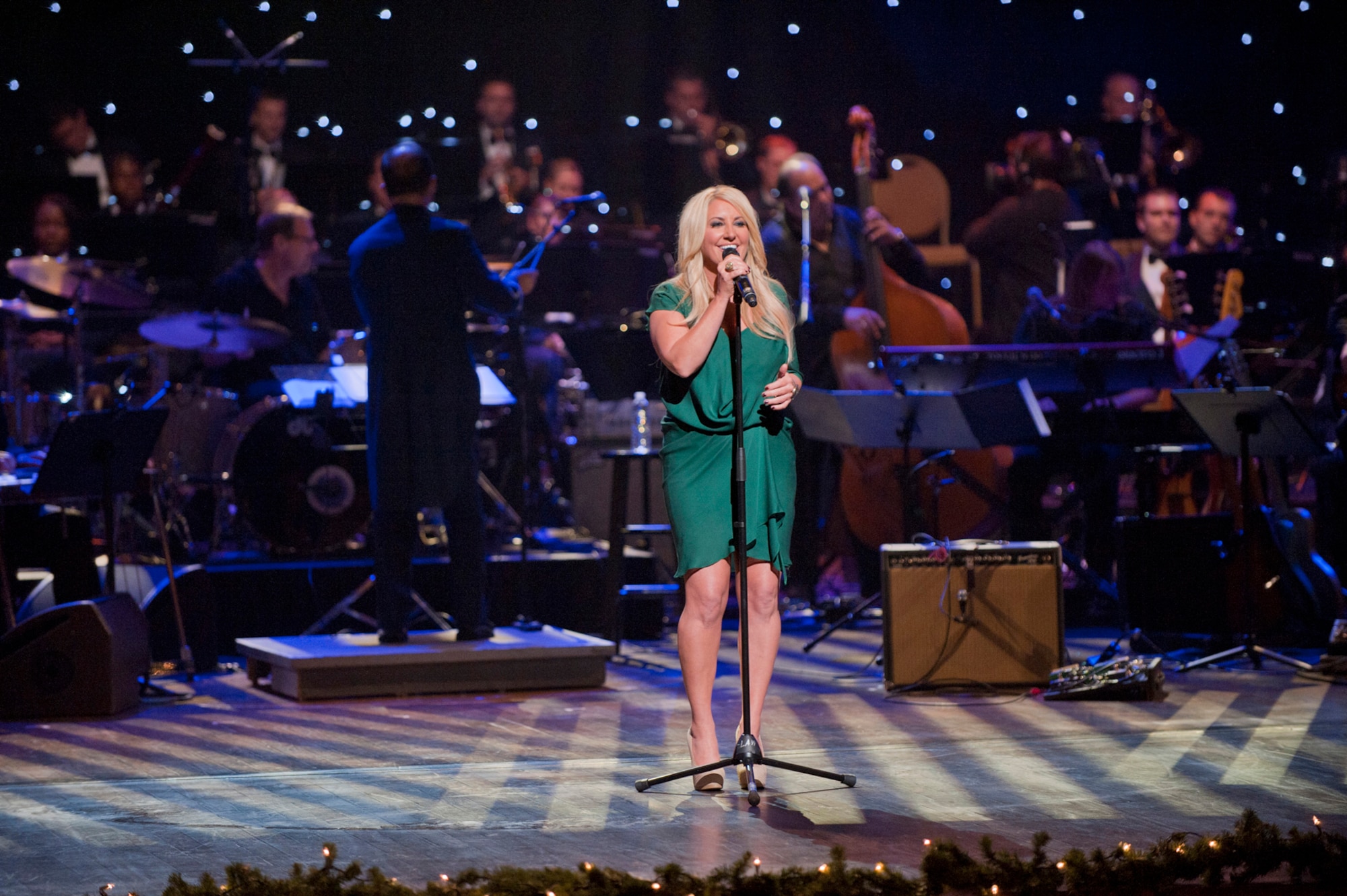 Grammy winning vocalist Lee Ann Womack performs during the taping of "Holiday Notes from Home" at the Grand Ole Opry House, Nashville, Tenn. Womack joined Little Big Town, the Band of the U.S. Air Force Reserve and the Air Force Strings to record the hour-long special that will air on the American Forces Network and the Great American Country Network this holiday season. (U.S. Air Force photo/Ken Hackman)