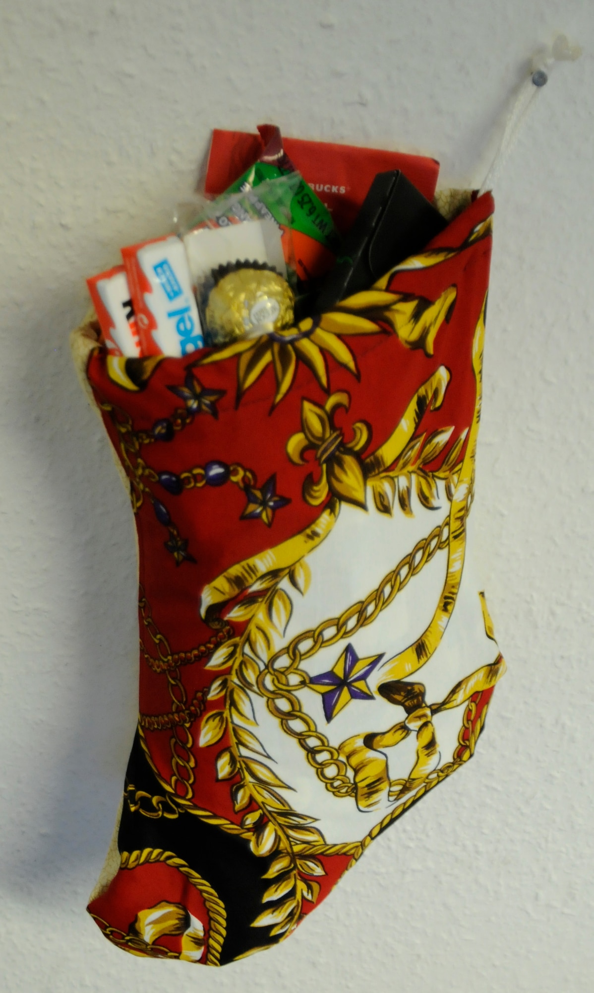 A “Jennywings Holiday Stocking” hangs on the wall Dec 7, 2011. Stockings are filled by volunteers to send to deployed troops or injured troops in hospitals. (U.S. Air Force photo illustration by Airman 1st Class Trevor Rhynes)