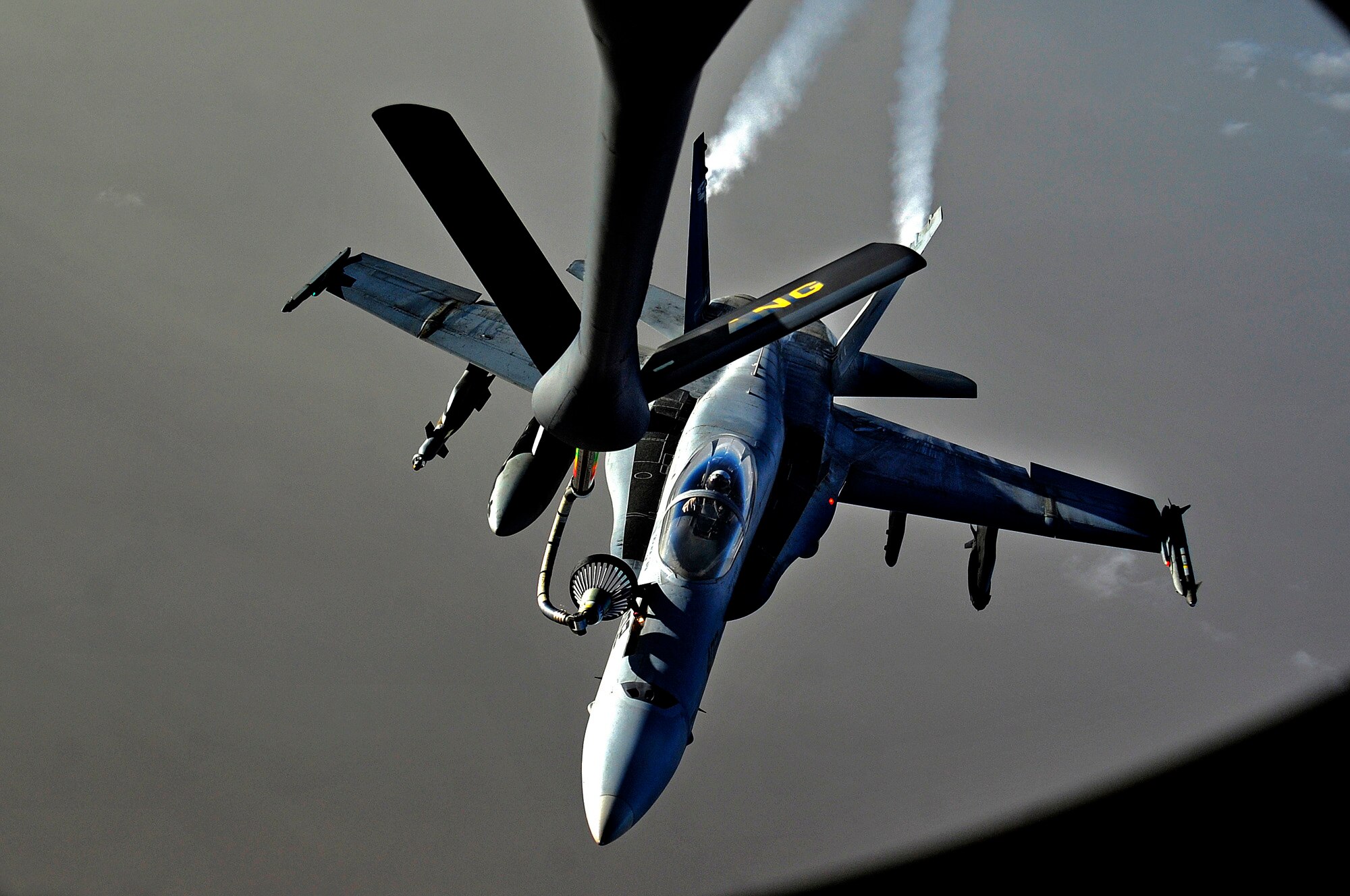 A Navy EA-18 Growler jet is refueled by a KC-135 Stratotanker aircraft over Iraq on Nov. 5, 2011. KC-135 Stratotankers with the 340th Expeditionary Air Refueling Squadron provided approximately 200,000 pounds of fuel each day to aerial assets in Iraq. (U.S. Air Force photo/Master Sgt. Cecilio Ricardo)