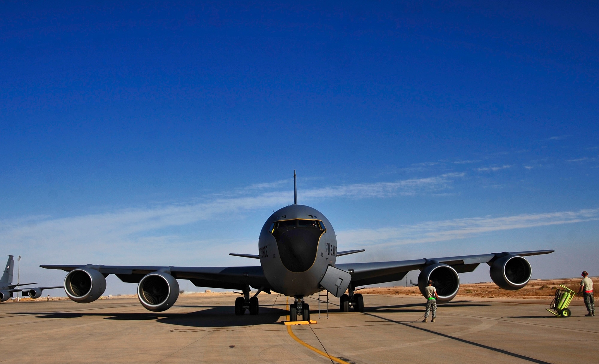 Airmen of the 340th Expeditionary Air Refueling Squadron prepare a KC-135 Stratotanker aircraft for take-off on Nov. 5, 2011. KC-135 Stratotankers provided approximately 200,000 pounds of fuel each day to aerial assets in Iraq. (U.S. Air Force photo/Master Sgt. Cecilio Ricardo)