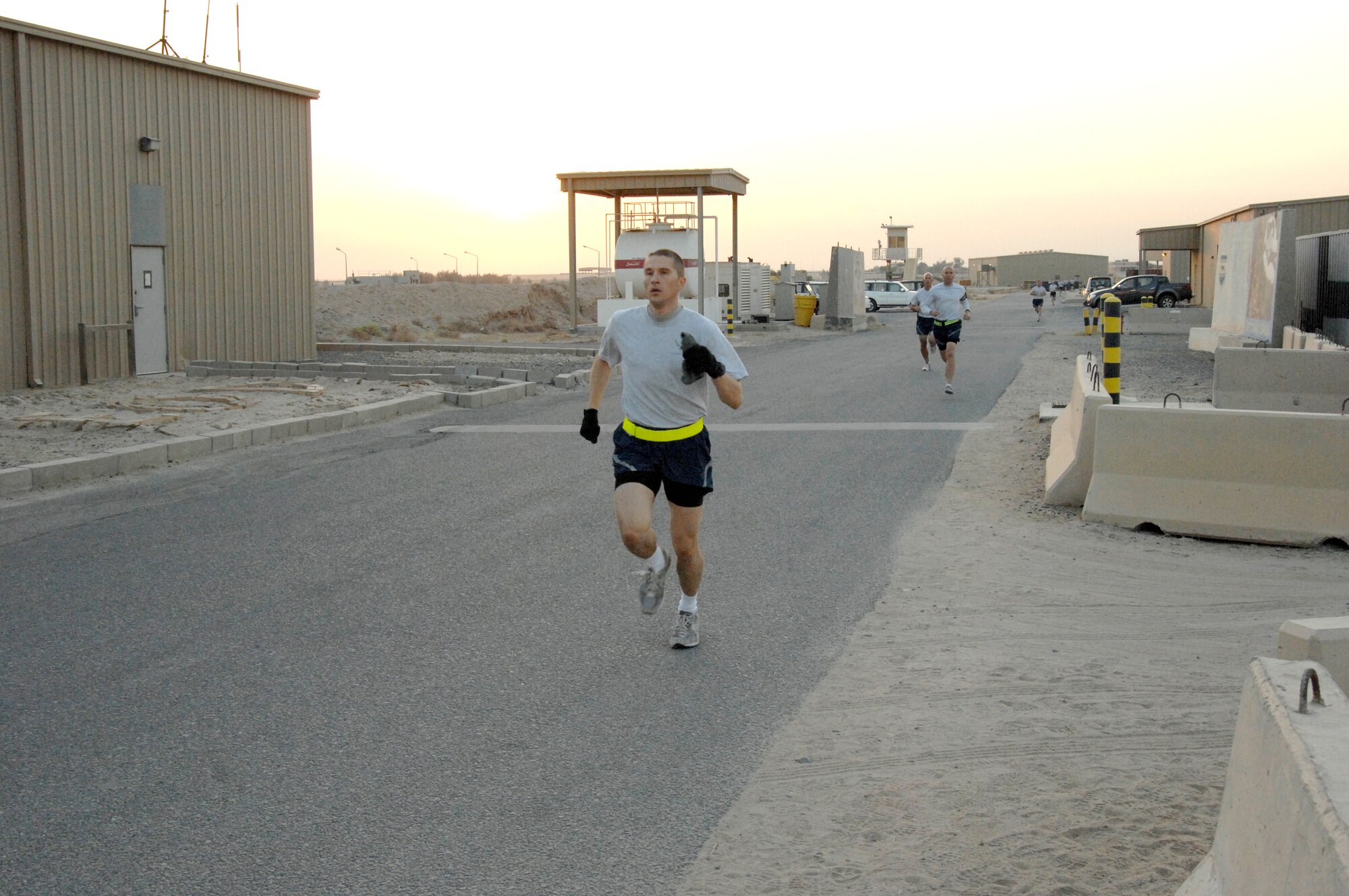 Staff Sgt. Ioan Gaitan, 332nd Expeditionary Civil Engineer Squadron surveying and draft team lead, runs in the Breast Cancer Awareness 5K. Gaitan was not always a runner, but lived a lifestyle that required running which he attributes to why he now enjoys it. (U.S. Air Force photo by Senior Airman Amber R. Kelly-Herard)