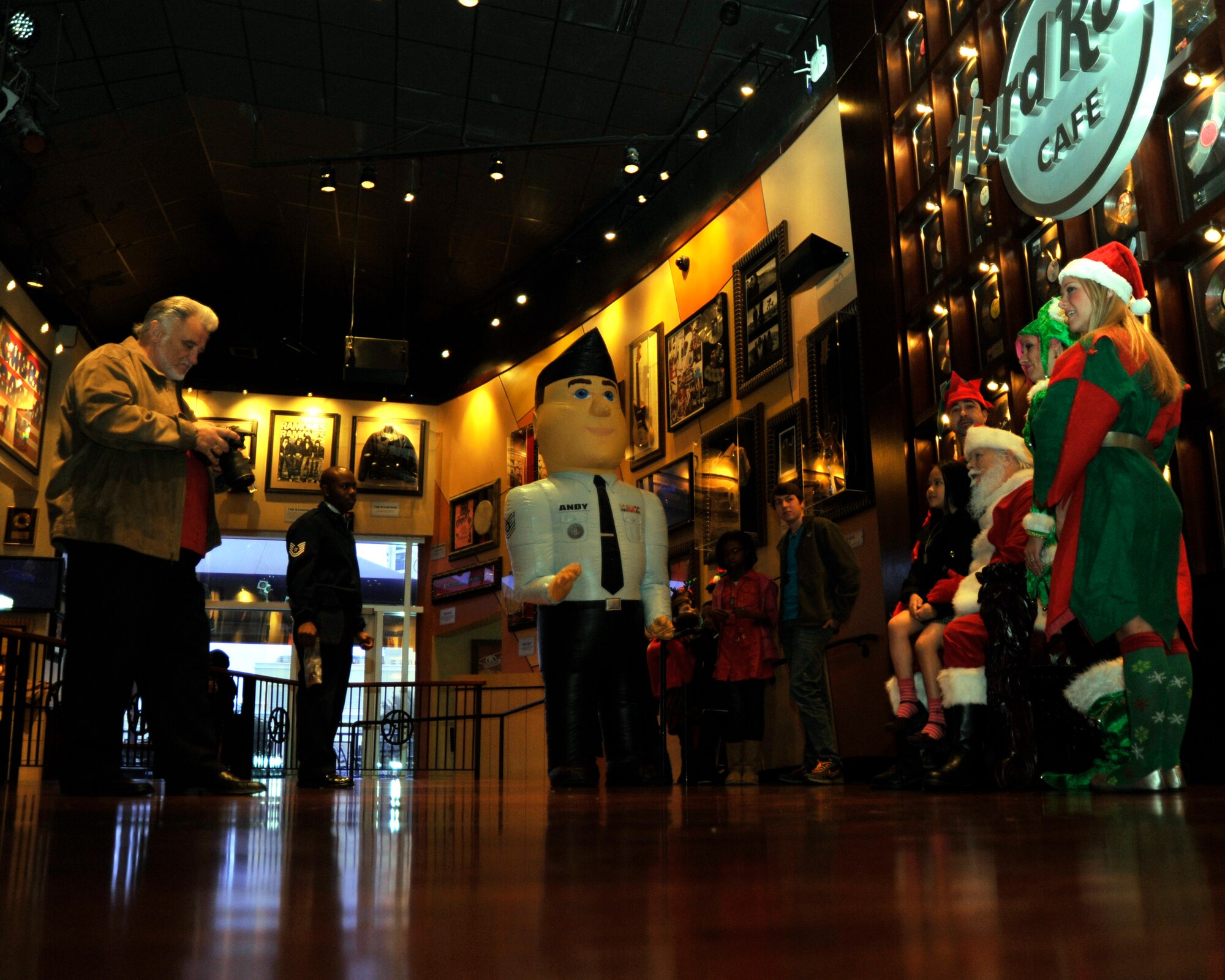 The 403rd Wing Recruiting Squadron teamed with Santa Claus to bring a morning of Christmas cheer to the Boys and Girls Club of Biloxi at the Hard Rock Cafe Dec. 10. Airman Andy entertained the children while they waited in line to tell their Christmas wish to Santa. (U.S. Air Force photo by Maj. Heather Newcomb)