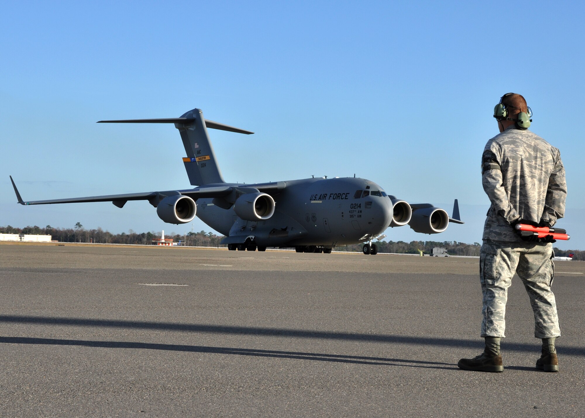 Piloted by Lt. Col. Mike DeSantis, of the 317th Airlift Wing, Joint Base Charleston's newest C-17 Globemaster III taxis to it's parking spot after a cross-country flight from the Boeing plant in Longbeach, Calif. Dec. 9, 2011.(U.S. Air Force Photo by Michael Dukes)