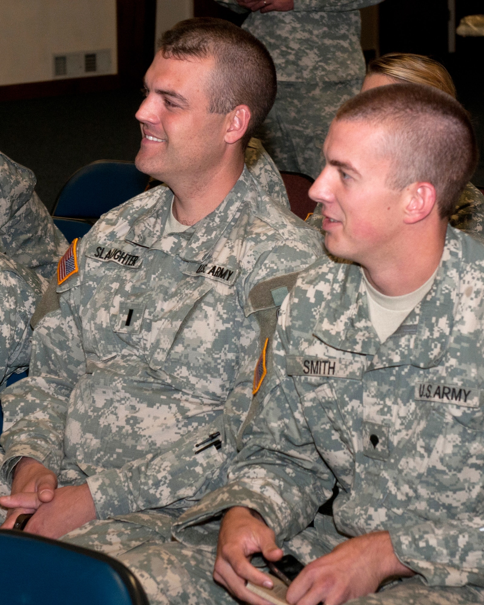 1st Lt. Mark Slaughter, a Kentucky Army National Guard chaplain candidate and Yellow Ribbon coordinator for the Louisville region, and Spc. Nathan Smith, a chaplain assistant for the 2/138th Headquarters Battalion, share a smile during the annual Joint Chaplaincy Corps Training Conference held at the Kentucky Air National Guard Base on Oct. 15. The corps uses the conference to prepare for upcoming events, new programs and policy changes such as the recent repeal of Don't Ask, Don't Tell.  (U.S. Air Force photo by Tech Sgt. Jason Ketterer)