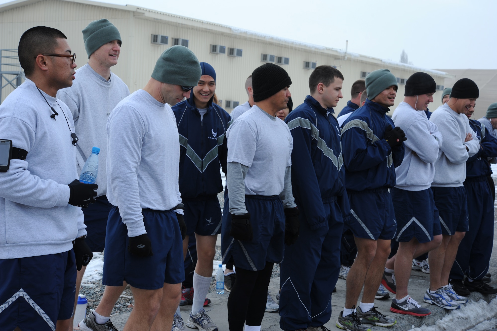 Capt. Ross Dotzlaf (third from left, looking down) prepares for his final 5K race with members of his flight at the Transit Center at Manas, Kyrgyzstan, Dec. 10, 2011. Dotzlaf, the 376th Expeditionary Civil Engineer Squadron Programs Flight chief, set a goal to run 1,000 miles during his six-month deployment, but ended up running 1,111 miles at a 6-minute mile average. Dotzlaf is deployed from Peterson Air Force Base, Colo. (U.S. Air Force photo/Tech. Sgt. Hank Hoegen)