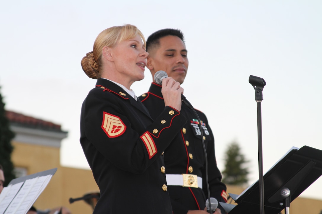 Families gathered aboard Marine Corps Recruit Depot San Diego during the chilly evening Dec.10. Under lights of green, red and gold, they chatted merrily with one another as they settled down to watch the evening’s events unfold.