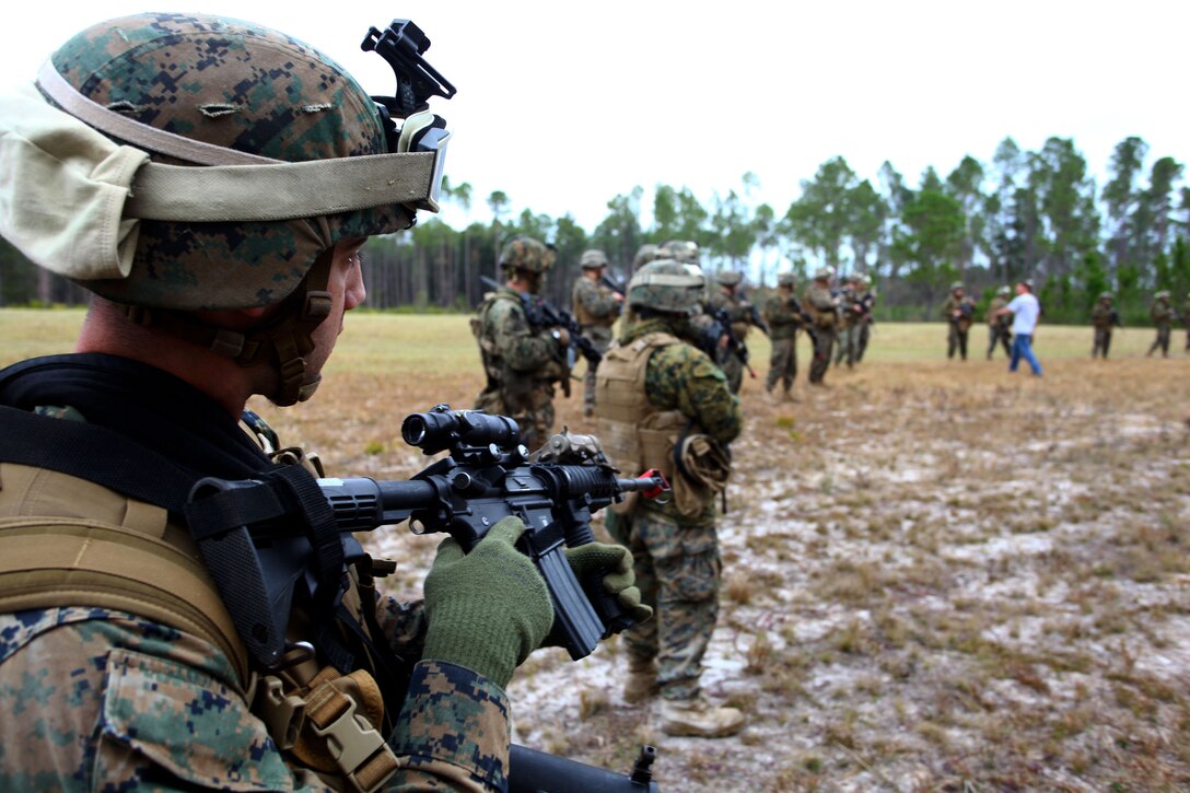 Marines with Bravo Company, Battalion Landing Team 1st Battalion, 2nd Marine Regiment, 24th Marine Expeditionary Unit, secure a landing site and distribution center during a simulated humanitarian assistance operation here Dec. 10, 2011. Supporting humanitarian assistance and disaster relief missions is a task that MEUs train for during their six-month work up period to prepare for deployment. The 24th MEU is currently taking part in Composite Training Unit Exercise (COMPTUEX), scheduled to take place Nov. 28 to Dec. 21. The training is meant to develop cohesion between the 24th MEU and Amphibious Squadron 8 (PHIBRON 8) in conducting amphibious operations, crisis response, and limited contingency operations while operating from the sea.