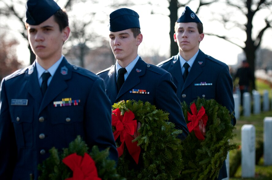 ARLINGTON, Va. -- 459th Air Refueling Airmen and their families joined over 10,000 servicemembers and civilian volunteers for the annual wreath laying at Arlington National Cemetery Dec. 10. 459 ARW Airmen took part in almost every aspect of the event, including transporting thousands of wreaths in trucks, greeting volunteers at the front gates and providing security. An estimated 85,000 wreaths were placed on the gravestones of fallen servicemembers and their loved ones. (U.S. Air Force photo/Tech. Sgt. Steve Lewis)