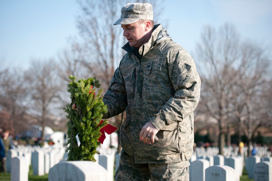 ARLINGTON, Va. -- 459th Air Refueling Airmen and their families joined over 10,000 servicemembers and civilian volunteers for the annual wreath laying at Arlington National Cemetery Dec. 10. 459 ARW Airmen took part in almost every aspect of the event, including transporting thousands of wreaths in trucks, greeting volunteers at the front gates and providing security. An estimated 85,000 wreaths were placed on the gravestones of fallen servicemembers and their loved ones. (U.S. Air Force photo/Tech. Sgt. Steve Lewis)