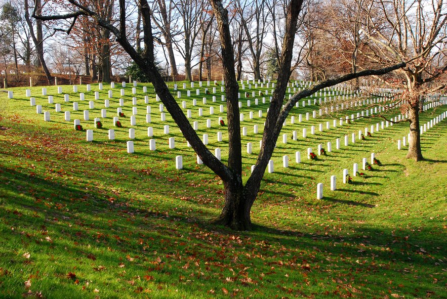 ARLINGTON, Va. -- 459th Air Refueling Airmen and their families joined over 10,000 servicemembers and civilian volunteers for the annual wreath laying at Arlington National Cemetery Dec. 10. 459 ARW Airmen took part in almost every aspect of the event, including transporting thousands of wreaths in trucks, greeting volunteers at the front gates and providing security. An estimated 85,000 wreaths were placed on the gravestones of fallen servicemembers and their loved ones. (U.S. Air Force photo/Tech. Sgt. Steve Lewis)