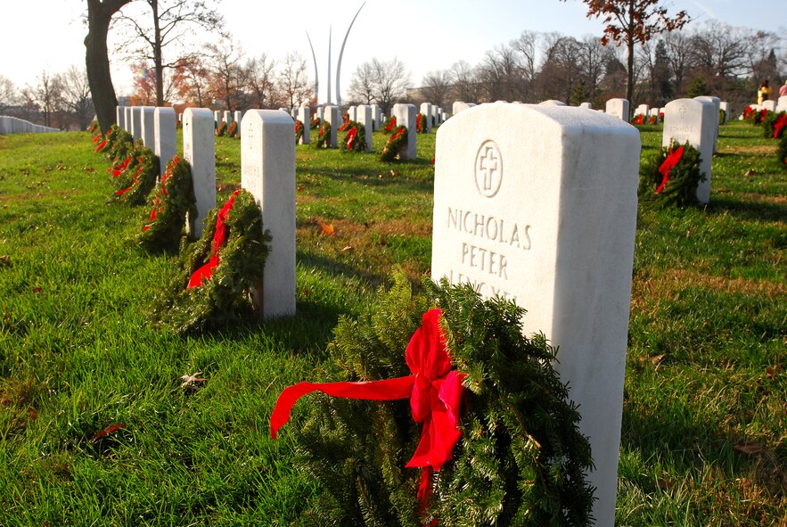 ARLINGTON, Va. -- 459th Air Refueling Airmen and their families joined over 10,000 servicemembers and civilian volunteers for the annual wreath laying at Arlington National Cemetery Dec. 10. 459 ARW Airmen took part in almost every aspect of the event, including transporting thousands of wreaths in trucks, greeting volunteers at the front gates and providing security. An estimated 85,000 wreaths were placed on the gravestones of fallen servicemembers and their loved ones. (U.S. Air Force photo/Tech. Sgt. Steve Lewis)
