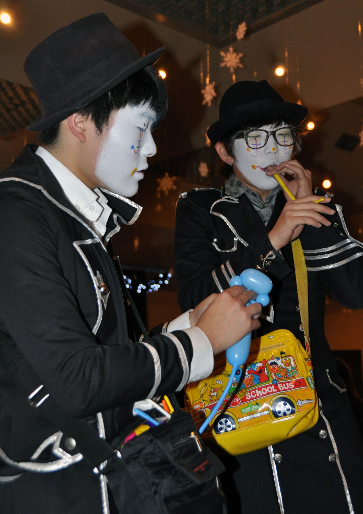 Republic of Korea peformers entertain guest with magic acts, comedic routines and balloon animals during Osan Air Base's Winterfest held at the Officers' Club Dec. 10, 2011. Winterfest is a base-wide event hosted by the 51st Fighter Wing that brings all of Team Osan together to celebrate the holidays with food, fun and entertainment. (U.S. Air Force photo/Airman 1st Class Michael Battles)