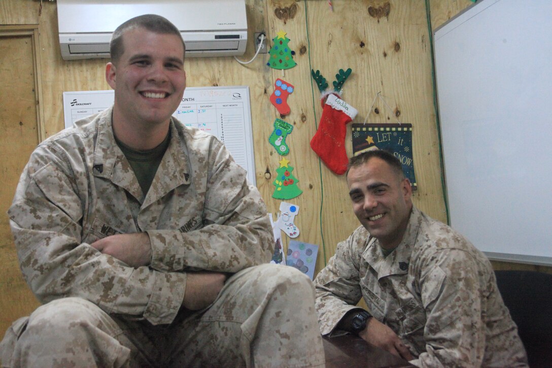 Staff Sgt. James Pribyl, right, and Cpl. Ernest Wetzel work together in Marine Wing Support Squadron 371 at Camp Leatherneck, Afghanistan. More than three years ago, on recruiting duty in Massachusetts, Pribyl recruited Wetzel into the Marine Corps. Pribyl, a native of Centerport, N.Y., now serves as the squadron's supply administration and operations chief. Wetzel, a maintenance management specialist with the squadron, is from Woodstock, Conn. Marine Wing Support Squadron 371 provides aviation ground support for all air assets operating in southwestern Afghanistan.::r::::n::