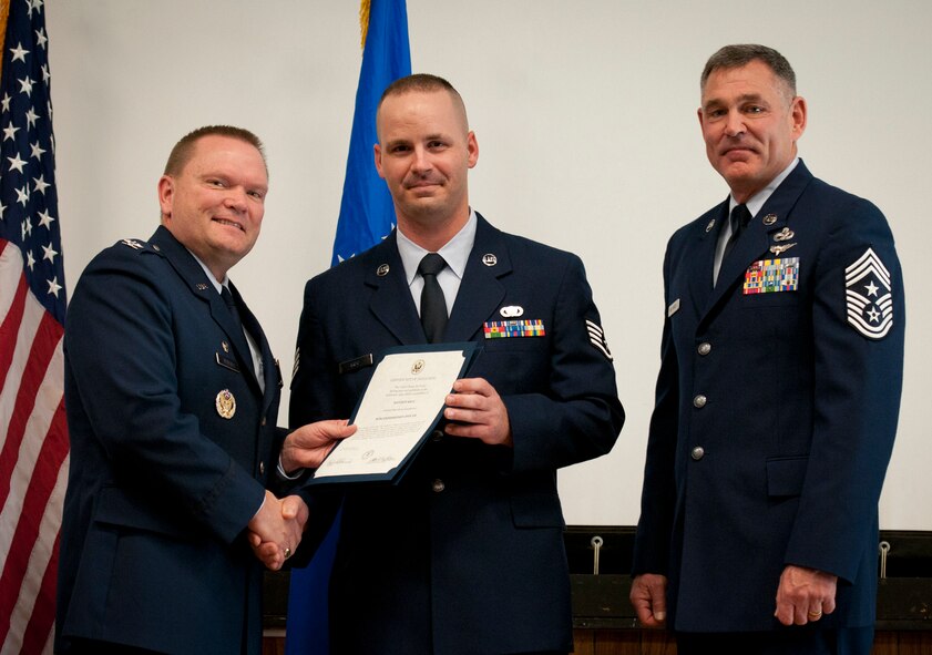 JOINT BASE ANDREWS, Md. -- The 459th Air Refueling Wing held its third Non-comissioned officer and Senior Non-commissioned officer induction ceremony of 2011 in the Wing Auditorium here, Dec. 4, 2011. The induction ceremonies are sponsored by the wing's Top 3 organization and are held at multiple times throughout the year for Airmen who have made the NCO and SNCO ranks. (U.S. Air Force photo/Tech. Sgt. Steve Lewis)