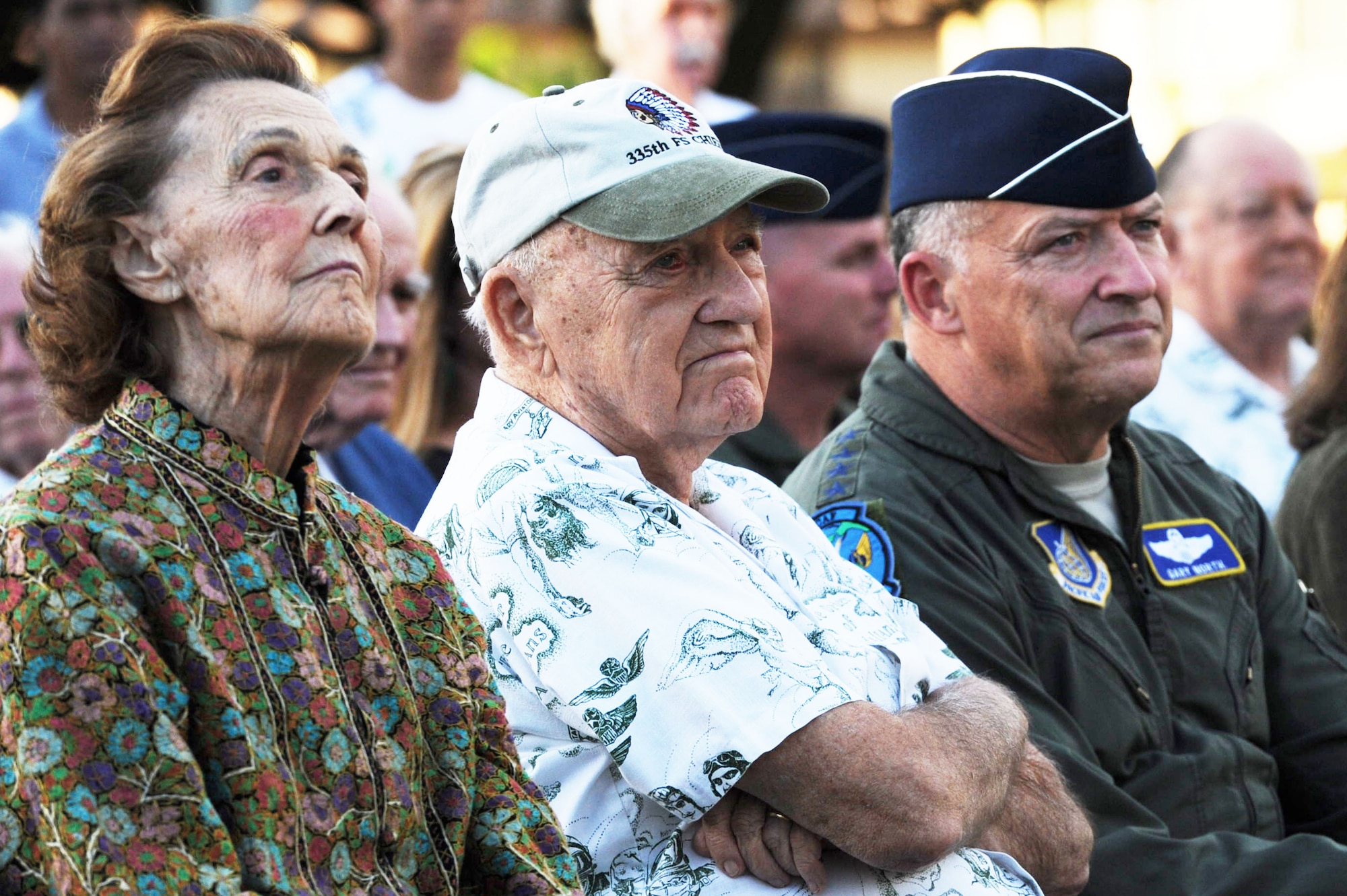 Mildred Taylor Marshall, who served in WWII as one of the original Women Airforce Service Pilots, retired U.S. Air Force Lt. Gen. Winton W. “Bones” Marshall, Korean War ace and former Pacific Air Forces vice commander in chief, and Gen. Gary North, PACAF commander, sit together during the static F-86E Sabre fighter aircraft dedication ceremony at Joint Base Pearl Harbor-Hickam, Hawaii, Dec. 8, 2011. The Pacific Air Forces and 15th Wing leadership dedicated the aircraft to Marshall in recognition of his sacrifice and service during the Korean War. He is credited with 6 1/2 enemy aircraft destroyed, seven probable aircraft destroyed and six aircraft damaged. (U.S. Air Force photo/Staff Sgt. Gustavo Gonzalez/Released)