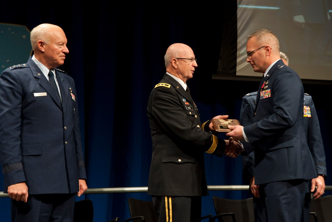 The 133rd Airlift Wing recognized outstanding achievements during the 2011 Recognition Ceremony Dec. 10, 2011, featuring director of the Air National Guard Lt. Gen. Harry M. Wyatt, III. He joined Maj. Gen. Rick Nash, adjutant general of the Minnesota National Guard, and Col. Greg Haase, commander of the 133rd Airlift Wing in the official party at the Wing awards ceremony. Over 1,000 Airmen, family and friend gathered in the North Hangar at the St. Paul Air National Guard base to celebrate the Outstanding Airmen of the Year and other award winners from the past twelve months. U.S. Air Force photo by Tech. Sgt. Erik Gudmundson (released)