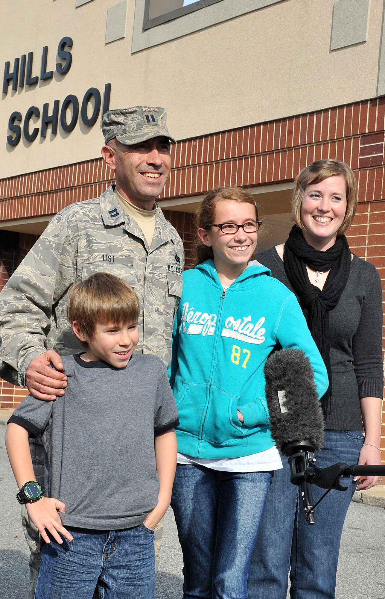 The List family was reunited Dec. 9 during two surprise welcome home events at Warner Robins Middle and Shirley Hills Elementary Schools. From left: James, Capt. Nathan List, Chloe, and Senior Master Sgt Lisa List. The captain ended his six-month deployment to Al Asad Air Base, Iraq, three weeks early, and with the help of his wife and the school staffs, was able to surprise his children in their classrooms. “It was a long road home,” said List. “Tuesday (Dec.  6) I was in Iraq and today I’m with my family. It’s a great feeling,” he said.  List is assigned to the Headquarters Air Force Reserve Command Security Forces Directorate as the Chief of Contingency and Readiness Plans.  Sergeant List is also assigned to the AFRC Judge Advocate directorate as the Reserve Paralegal Program Manager. (U.S. Air Force photo/Tommie Horton)