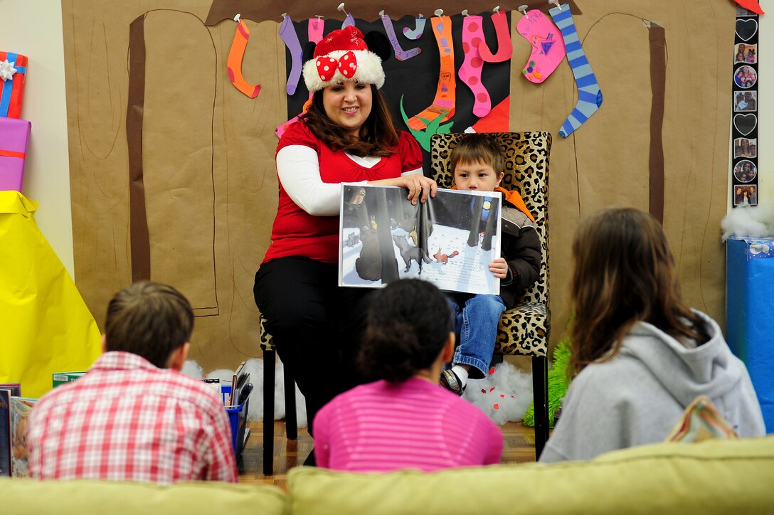 Dependants of active duty service members read Christmas stories during Breakfast with Santa at Langley Air Force Base, Va., Dec. 10, 2011. Along with meeting Santa Clause, children participated in several other holiday themed activities that the Langley Youths Program hosted.    (U.S. Air Force photo by Airman 1st Class Kayla Newman/Released) 