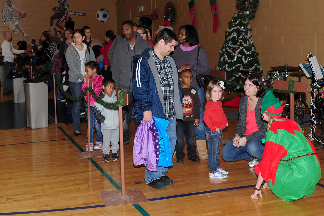 Children wait for their turn to visit with Santa Clause to tell him what they want for Christmas during Breakfast with Santa at Langley Air Force Base, Va., Dec. 10, 2011. Children ate breakfast with Santa and participated in other holiday activities during the annual event. (U.S. Air Force photo by Airman 1st Class Kayla Newman/Released)