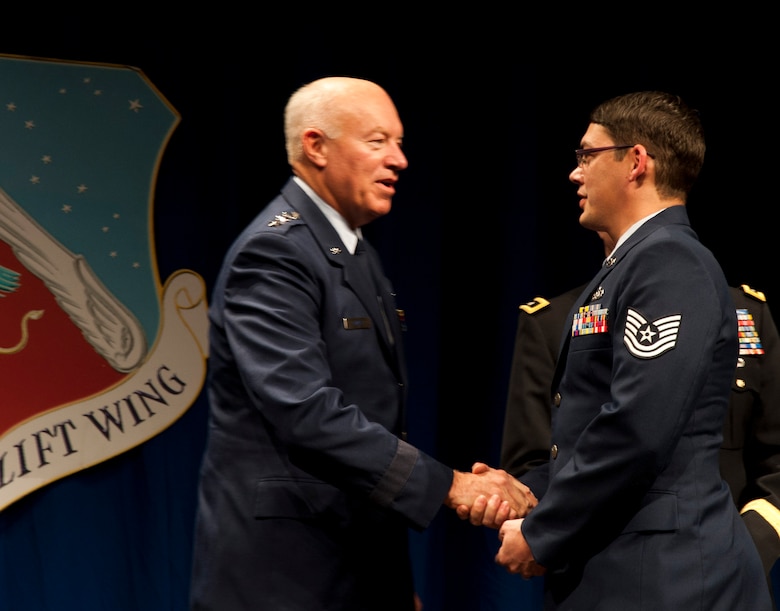 The 133rd Airlift Wing recognized outstanding achievements during the 2011 Recognition Ceremony Dec. 10, 2011, featuring director of the Air National Guard Lt. Gen. Harry M. Wyatt, III. He joined Maj. Gen. Rick Nash, adjutant general of the Minnesota National Guard, and Col. Greg Haase, commander of the 133rd Airlift Wing in the official party at the Wing awards ceremony. Over 1,000 Airmen, family and friend gathered in the North Hangar at the St. Paul Air National Guard base to celebrate the Outstanding Airmen of the Year and other award winners from the past twelve months. U.S. Air Force photo by Tech. Sgt. Erik Gudmundson (released)