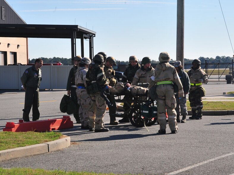 U.S. Air Force Airmen with the 23rd Medical Group assist a simulated injured Airman after an attack during a phase II operational readiness exercise at Moody Air Force Base, Ga., Dec. 8, 2011. The Airman was taken to the deployed medical facility for further evaluation and assessment of injury. Quickly assessing injuries is vital to sustaining Air Force operations along with saving time and our most unique asset-our Airmen. (U.S. Air Force photo by Staff Sgt. Stephanie Mancha/Released)
