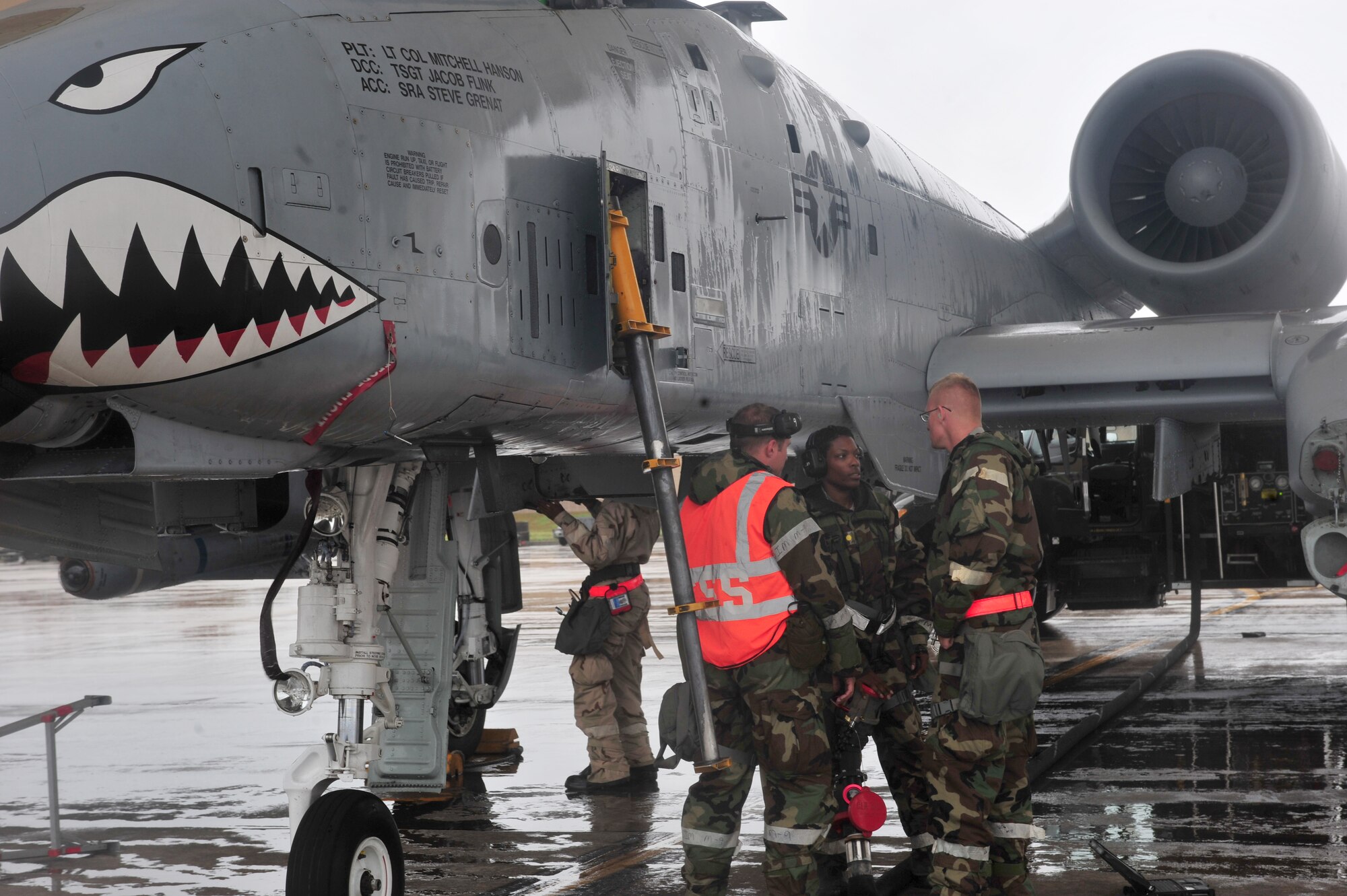 U.S. Air Force crew chiefs with the 23rd Aircraft Maintenance Squadron prepare an A-10C Thunderbolt II aircraft for refueling during a phase II operational readiness exercise at Moody Air Force Base, Ga., Dec. 7, 2011. The A-10 received maintenance, a weapons load and fuel. (U.S. Air Force photo by Staff Sgt. Stephanie Mancha/Released)
