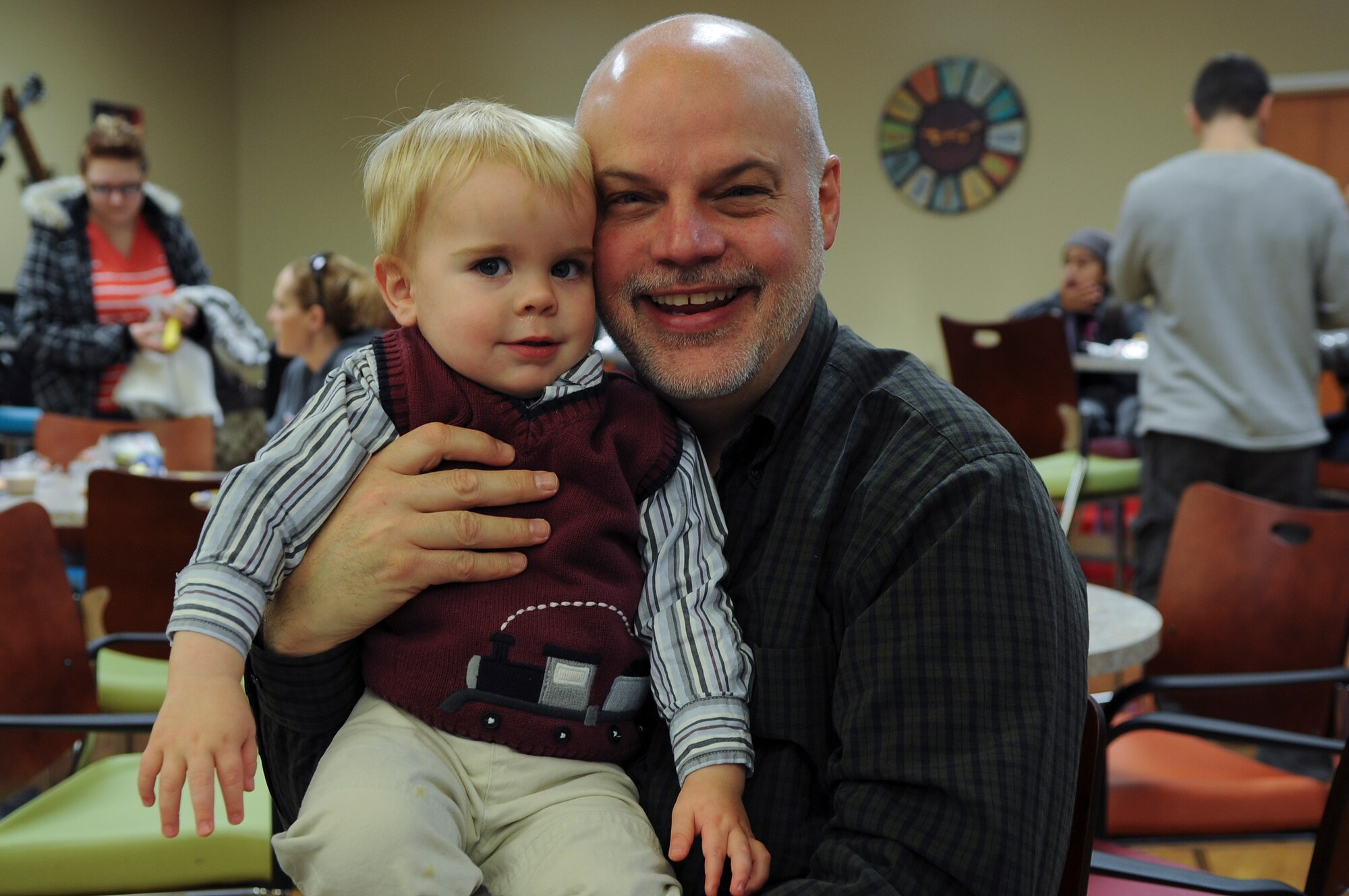 Greg Goodwin, realtor, and his grandson, Mason, pose for the camera during the 23rd Force Support Squadron’s annual Breakfast with Santa at Moody Air Force Base, Ga., Dec. 10, 2011. The 23rd FSS has been involved with the event for about six years. (U.S. Air Force photo by Airman 1st Class Olivia Dominique/Released)