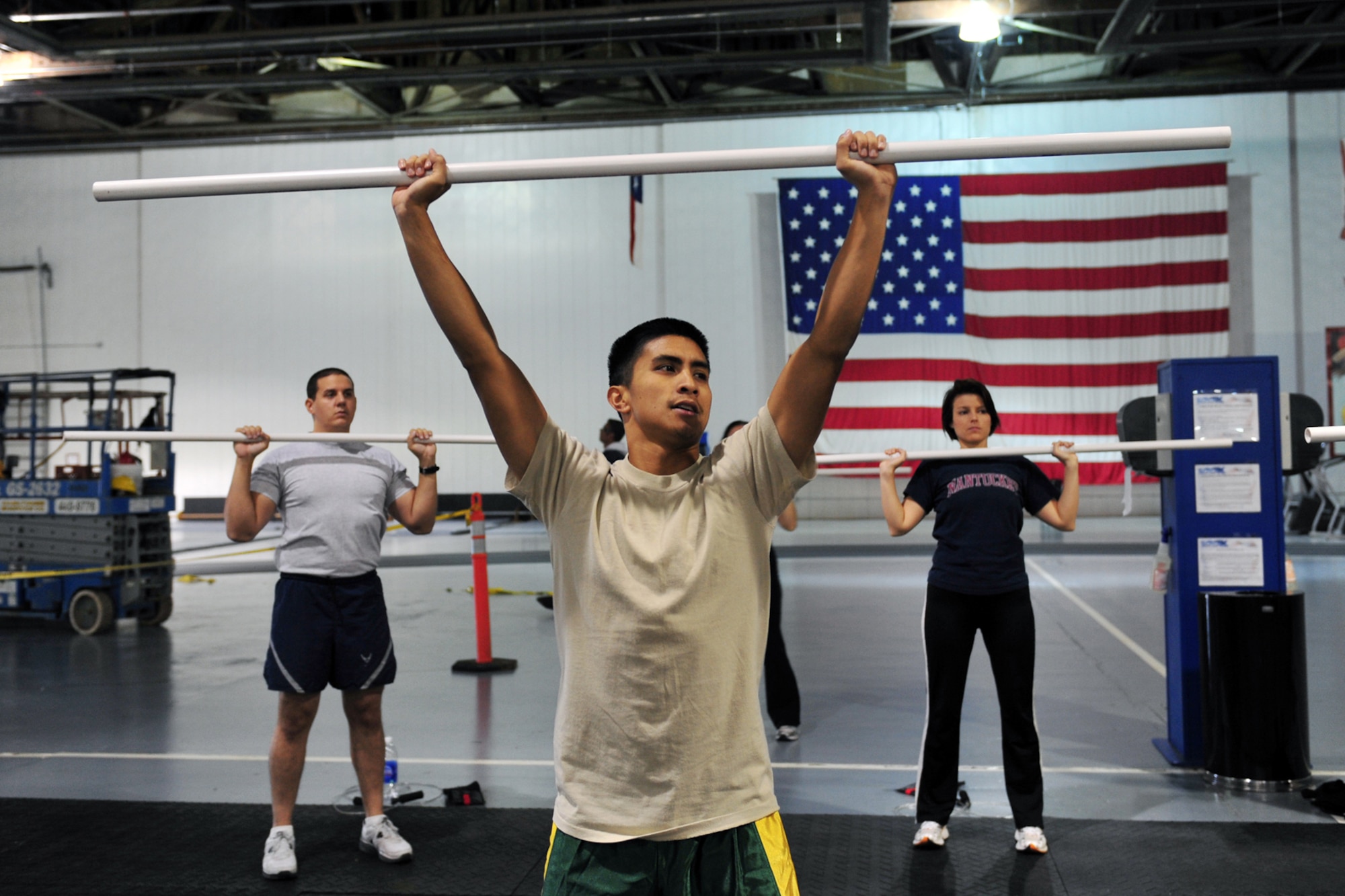 U.S. Air Force 1st Lt. Jason Utulo, 343rd Reconnaissance Squadron, does a shoulder press during the tactical fitness class in the field house on Offutt Air Force Base, Neb., Nov. 03. A select group of students chosen by unit fitness program managers are currently evaluating the course before it's made available to Team Offutt members in January. (U.S. Air Force Photo by Charles Haymond/Released)