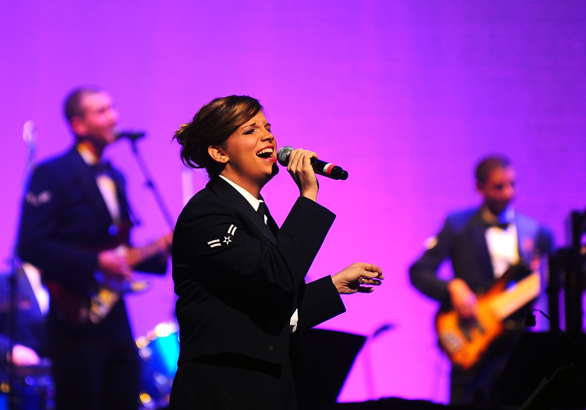 U.S. Air Force Airman 1st Class Melissa Rager, a vocalist with U.S. Air Force Heartland of America Band, gives her first performance at the Holland Performing Arts Center as part of the "Silver and Gold" holiday concert in Omaha, Neb., Dec. 7.  The 2011 concert marked the 25th anniversary of the annual concert.  (U.S. Air Force Photo by Josh Plueger/Released)