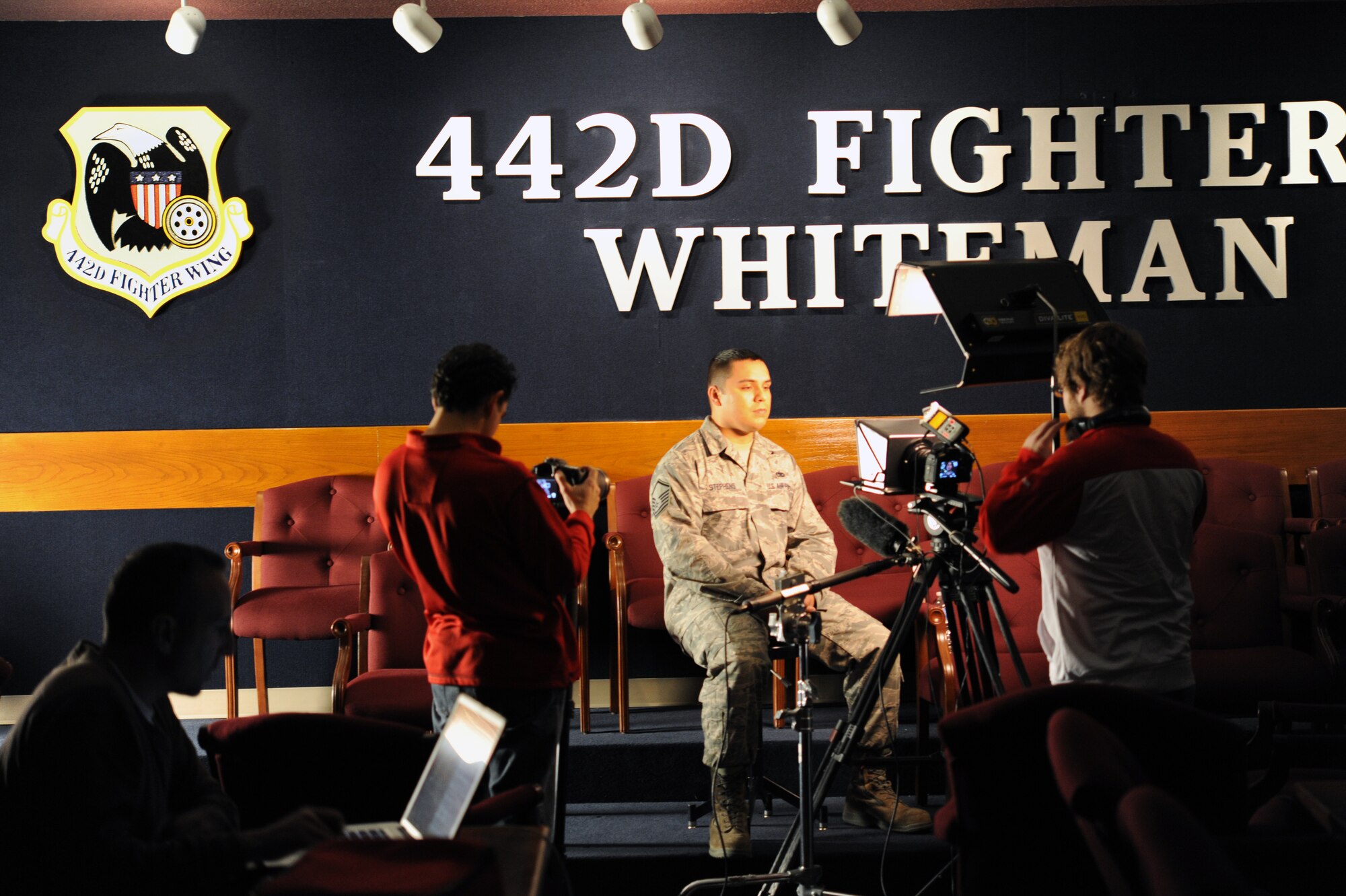 Master Sgt. Michael Stephens, 442nd Aircraft Maintenance Squadron electro-environmental technician, answers questions about his military service and his history as a dedicated Kansas City Chiefs fan, Dec. 9, 2011. The KC Chiefs is a National Football League team that is making a web episode about the 442nd Fighter Wing for their internet-based show, Chiefs Kingdom. The 442nd Fighter Wing is an A-10 Thunderbolt II Air Force Reserve unit at Whiteman Air Force Base, Mo. (U.S. Air Force photo/Staff Sgt. Danielle Wolf)