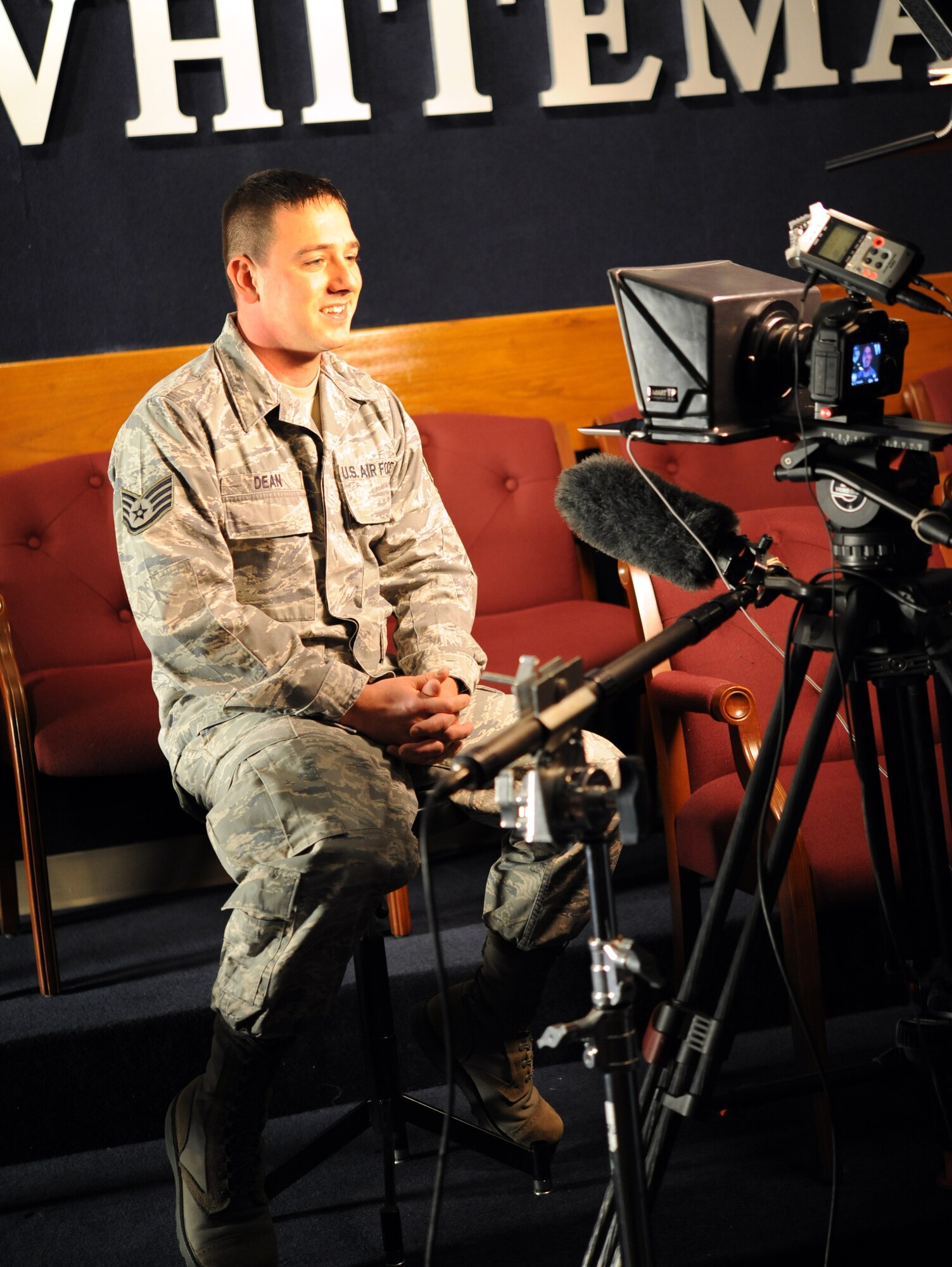 Staff Sgt. Rick Dean, 442nd Aircraft Maintenance Squadron electro-environmental technician, answers questions about his military service and his history as a dedicated Kansas City Chiefs fan, Dec. 9, 2011. The KC Chiefs is a National Football League team that is making a web episode about the 442nd Fighter Wing for their internet-based show, Chiefs Kingdom. The 442nd Fighter Wing is an A-10 Thunderbolt II Air Force Reserve unit at Whiteman Air Force Base, Mo. (U.S. Air Force photo/Staff Sgt. Danielle Wolf)