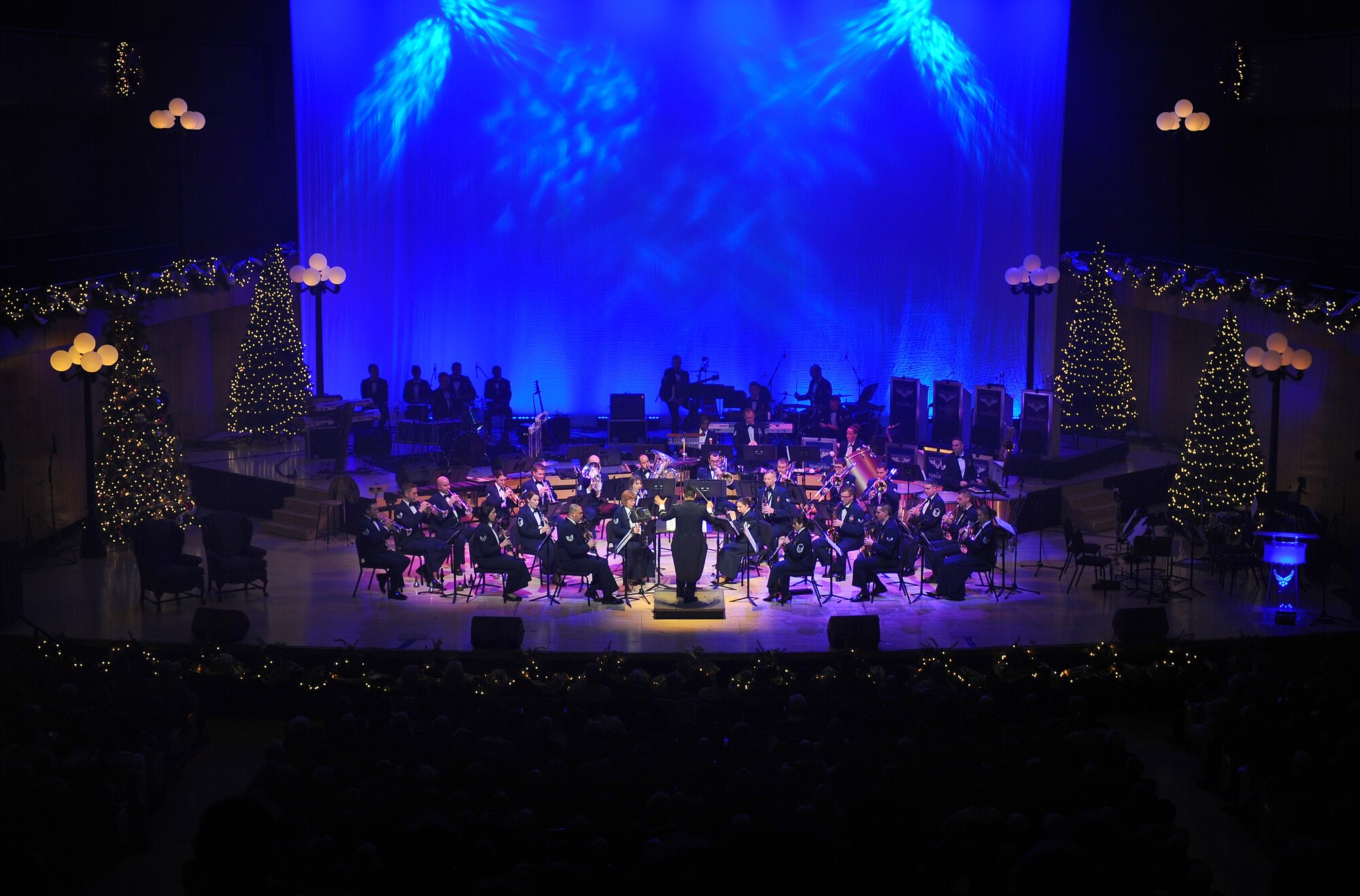 The U.S. Air Force Heartland of America Band's concert ensemble performed at the "Silver and Gold" holiday concert at the Holland Performing Arts Center in Omaha, Neb., Dec. 7.  The concert marked the 25th anniversary of holiday performances by the band.  (U.S. Air Force Photo by Josh Plueger/Released)