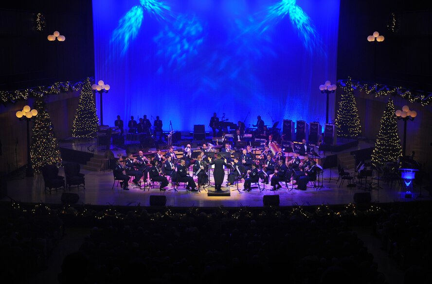 The U.S. Air Force Heartland of America Band's concert ensemble performed at the "Silver and Gold" holiday concert at the Holland Performing Arts Center in Omaha, Neb., Dec. 7.  The concert marked the 25th anniversary of holiday performances by the band.  (U.S. Air Force Photo by Josh Plueger/Released)
