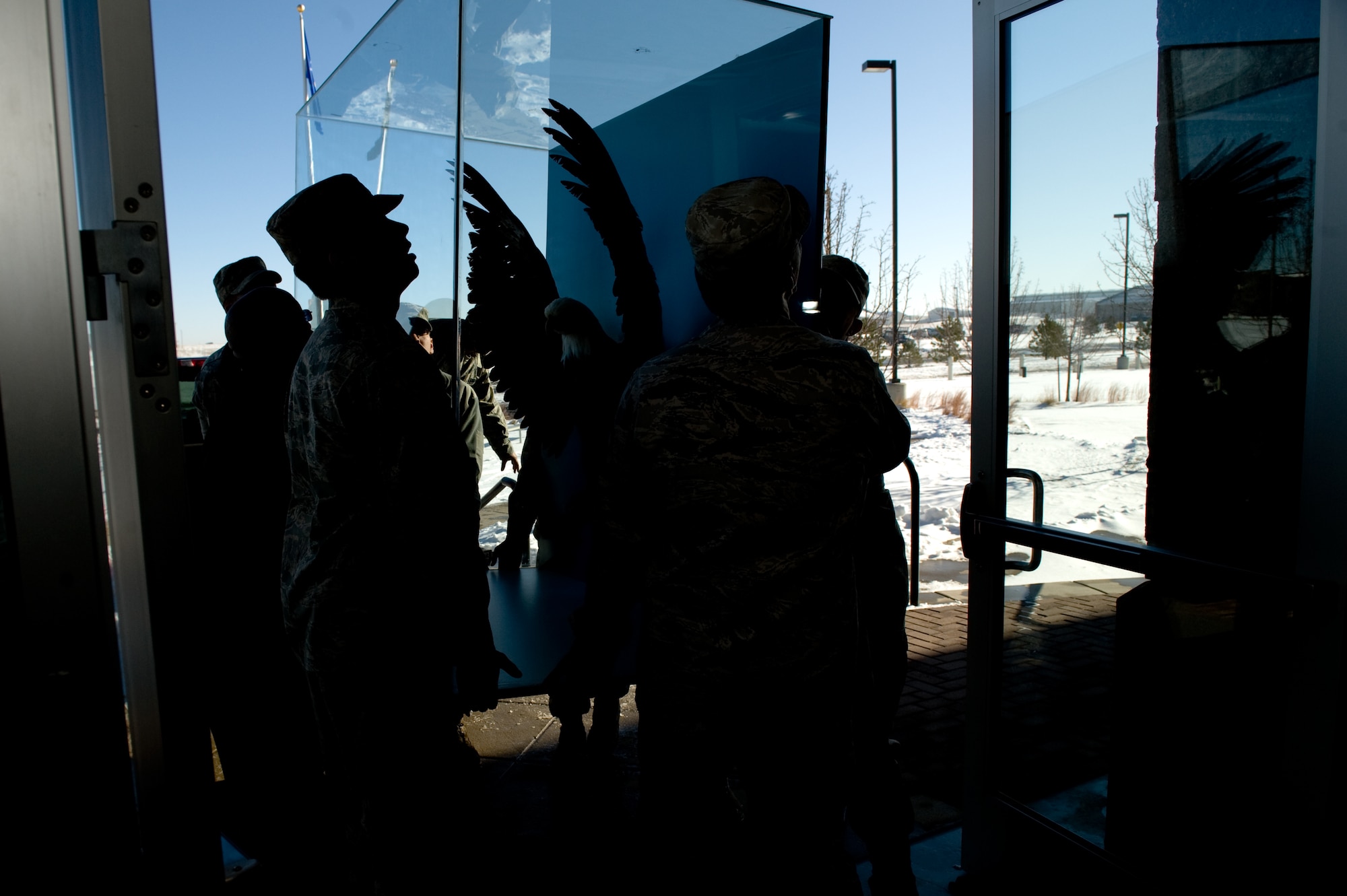 BUCKLEY AIR FORCE BASE, Colo. --  Members of the 460th Space Wing move Lucy, a preserved bald eagle, Dec. 2, 2011. The display was moved from the 140th Wing to the 460th Space Wing due to renovations. (Air Force photo by Airman 1st Class Phillip Houk)