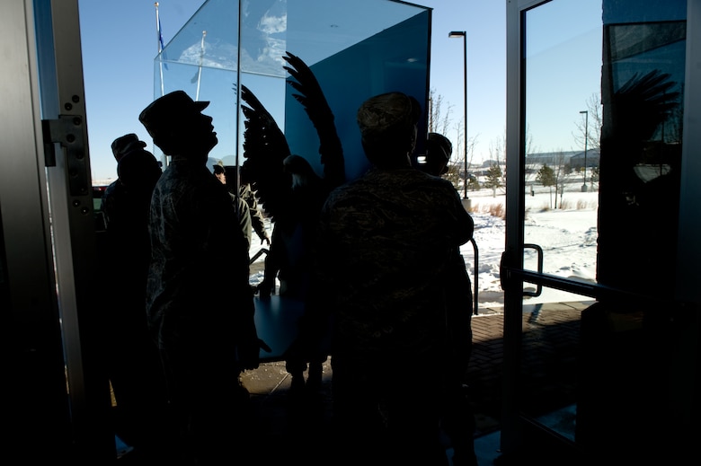 BUCKLEY AIR FORCE BASE, Colo. --  Members of the 460th Space Wing move Lucy, a preserved bald eagle, Dec. 2, 2011. The display was moved from the 140th Wing to the 460th Space Wing due to renovations. (Air Force photo by Airman 1st Class Phillip Houk)
