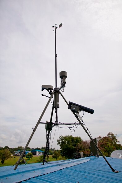 A recently-installed TMQ-53 sensor collects weather data from the top of a building at Edwin Andrews Air Base, Philippines. U.S. Air Force Airmen support flight operations in the southern Philippines by sharing the runway in Zamboanga, and providing weather forecasts in support of U.S. Joint Special Operations Task Force-Philippines. (U.S. Air Force Photo by Capt. Darrick B. Lee/released)