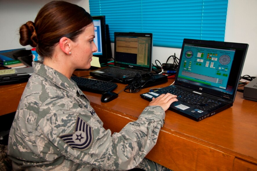U.S. Air Force Technical Sergeant Carrie Volpe, a weather forecaster deployed with Joint Special Operations Task Force-Philippines, remotely monitors the status of a TMQ-53 weather sensor 30 Nov. Through her computer, Volpe can provide real-time weather forecasting in support of special operations in the southern Philippines. (U.S. Air Force Photo by Capt. Darrick B. Lee/released)