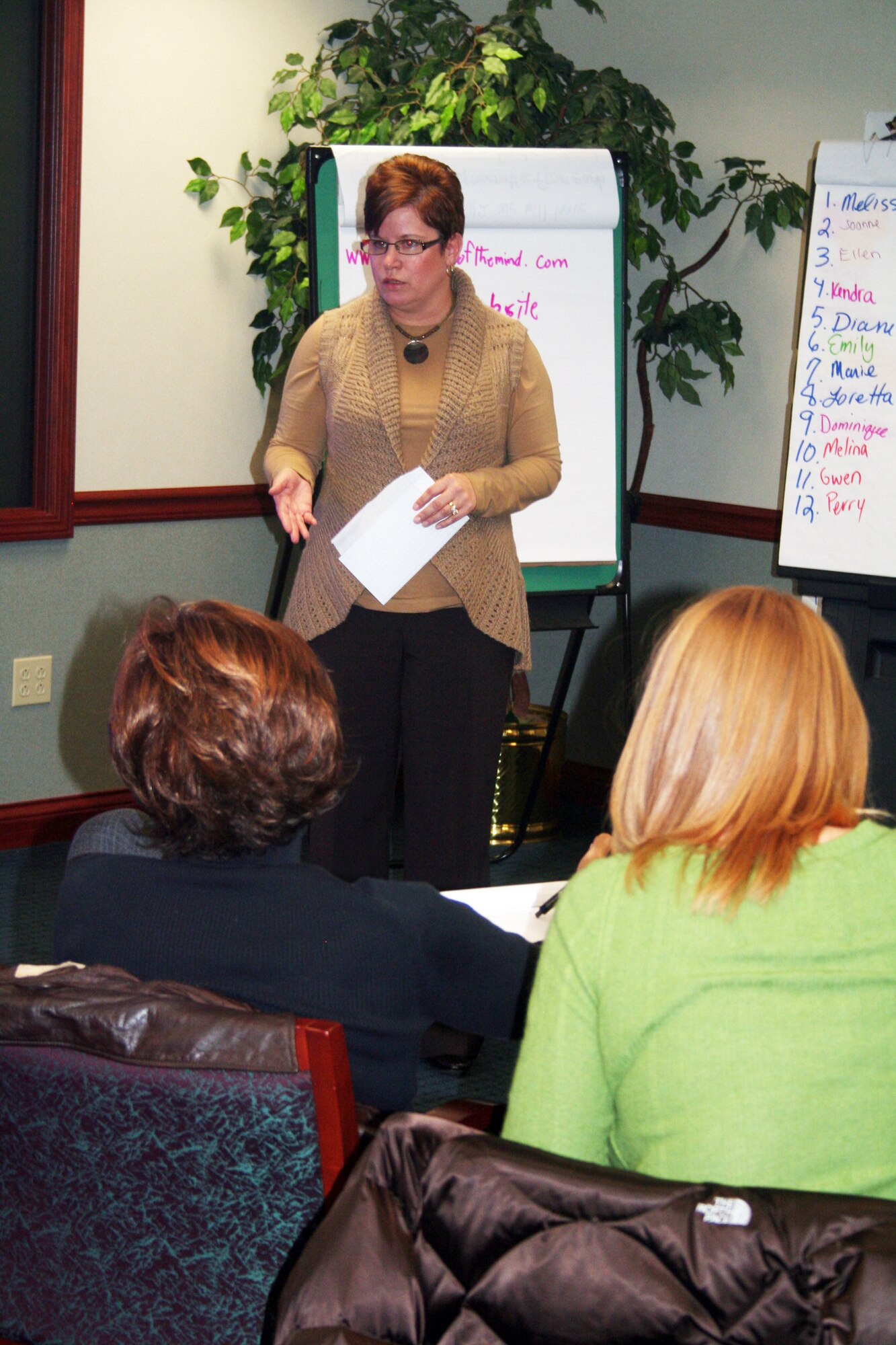 Kristy Grove, youth coordinator from Dover Air Force Base, Del., gives a presentation during advanced leadership training at Headquarters Air Mobility Command at Scott AFB, Ill., on Dec. 8, 2011. The training, led by AMC Headquarters with the Boys and Girls Clubs of America, was designed to "help youth and teen centers to move their programs from just being good to being great." The training, officials say, also falls in line with AMC's Comprehensive Airman Fitness culture of helping Airmen, Air Force civilians and family members become more resilient and better-equipped to deal with the rigors of military life. (U.S. Air Force Photo/Master Sgt. Scott T. Sturkol)