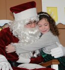 Children on base were served up a special breakfast Dec. 3 at the Honor Guard hangar. Santa Claus was available to hear children's gift requests and the children worked on Christmas crafts. (Air Force photo/Wendy Simonds)