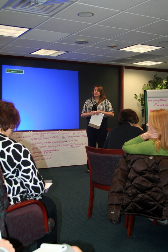 Kendra Giroud, youth coordinator from Fairchild Air Force Base, Wash., gives a presentation during advanced leadership training at Headquarters Air Mobility Command at Scott Air Force Base, Ill., on Dec. 8, 2011. The training, led by AMC Headquarters with the Boys and Girls Clubs of America, was designed to "help youth and teen centers to move their programs from just being good to being great." The training, officials say, also falls in line with AMC's Comprehensive Airman Fitness culture of helping Airmen, Air Force civilians and family members become more resilient and better-equipped to deal with the rigors of military life. (U.S. Air Force Photo/Master Sgt. Scott T. Sturkol)